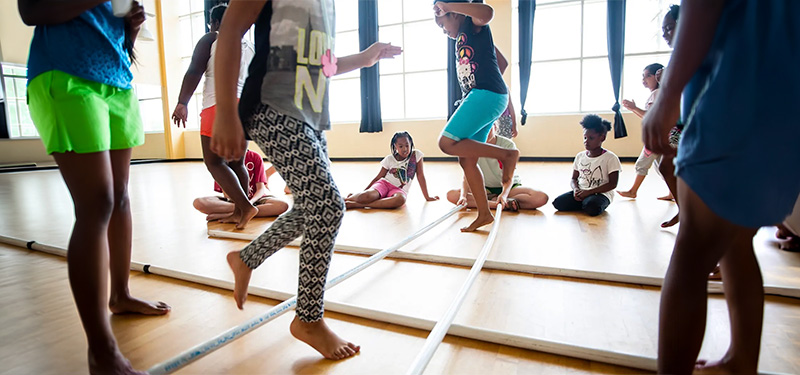 photo of young girls playing in a gymnasium